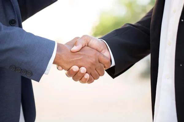 Mature African American casually dressed businessman shaking hands. — Stock Photo, Image
