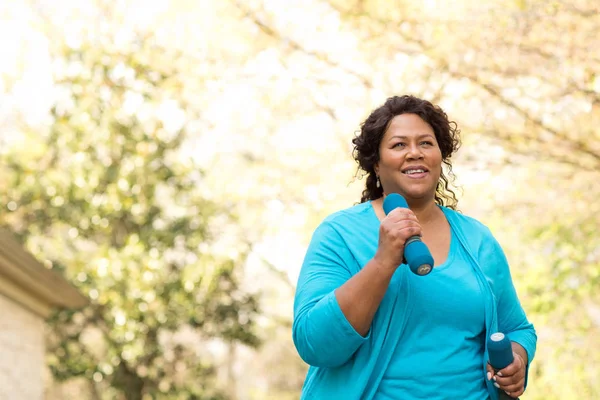 Beautiful mature African American woman smiling and laughing. — Stock Photo, Image