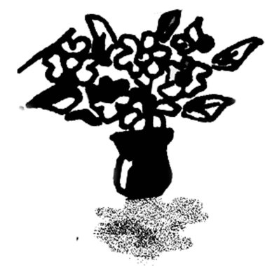 Masadaki çiçek vazosu.