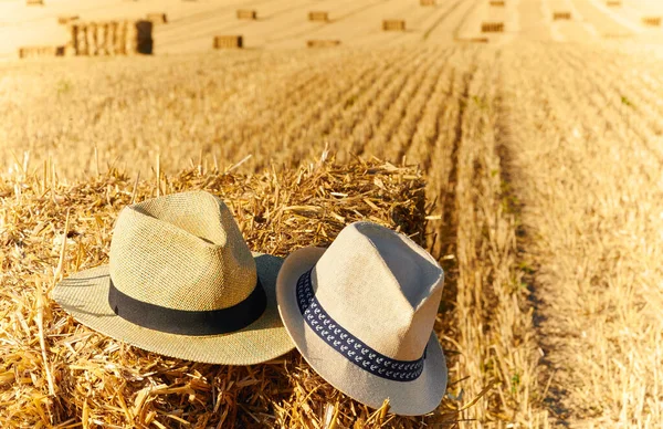 Straw hats on straw bales during harvest