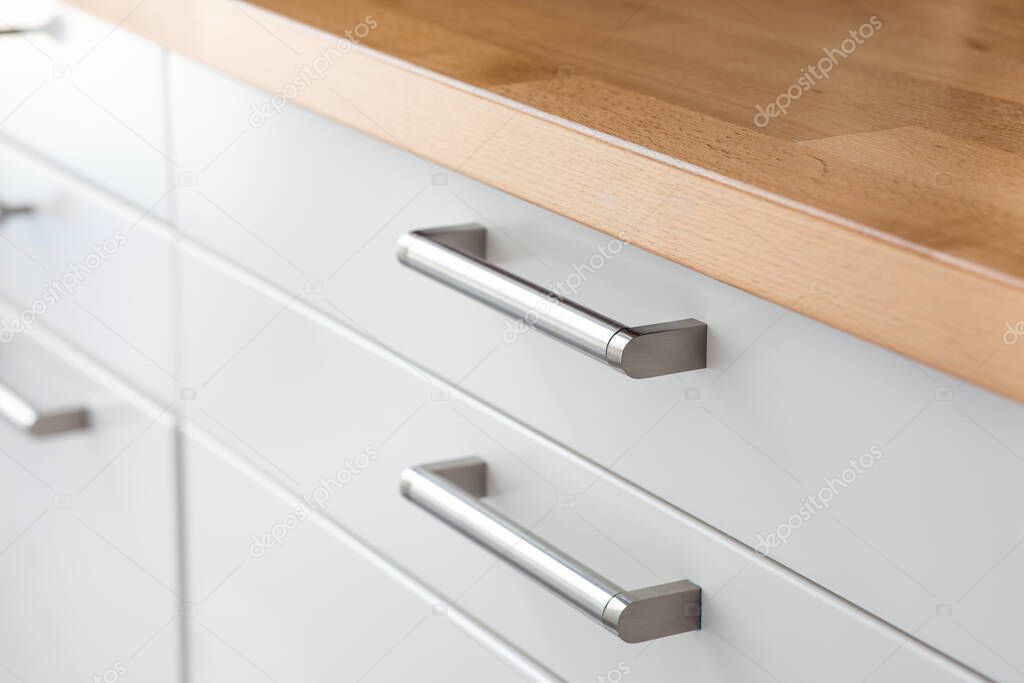 White drawer counter in kitchen.home furniture in minimal style