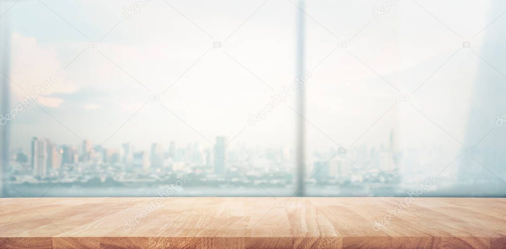 Empty wood table with blur  window city view background.For montage product display or design key visual layout.