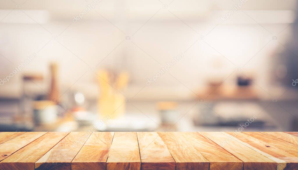 Wood texture table top (counter bar) with blur cafe, kitchen background.For montage product display or design key visual layout