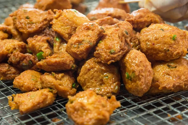 Deep fried Curry paste ocean fish or Fish curry pancake in Taling Chan Floating Markett at Bangkok, Thailand