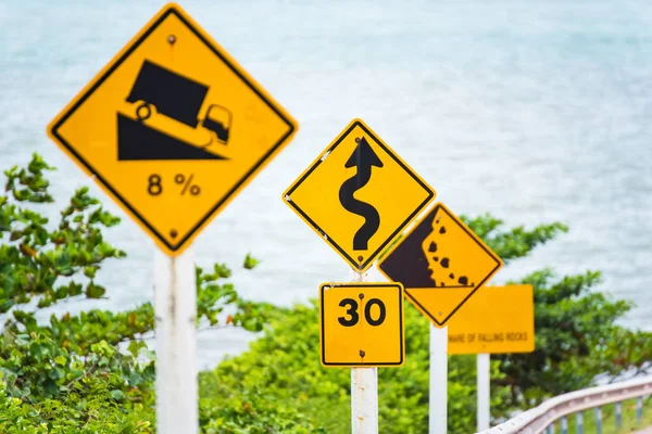 Steep Hill Descent Use Low Gear Traffic Sign on the Road in Thailand