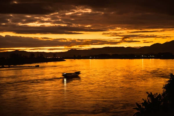 In the morning, the sun rises on the banks of the Mekong River i