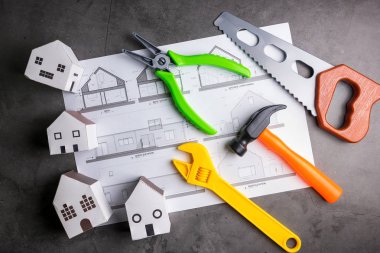 Kağıt kutu ev ve inşaat araçları oyuncak taş desen geri