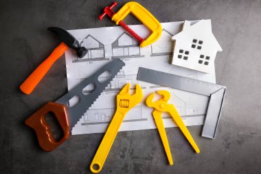 Ahşap ev ve inşaat araçları oyuncak taş desen backgro