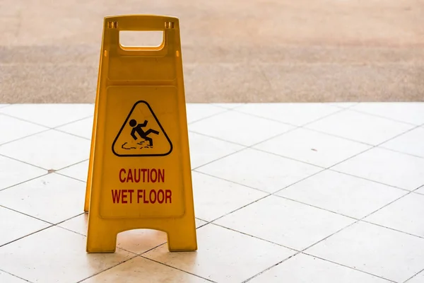 Warning beware accident concept, The image of yellow caution wet — Stock Photo, Image
