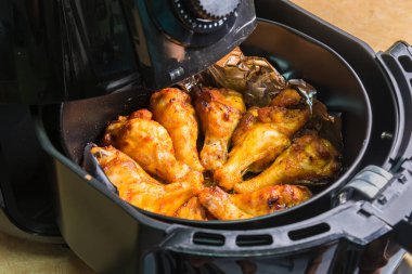 Grill BBQ Chicken Legs in oven air fryer.healthy cooking without oil clipart