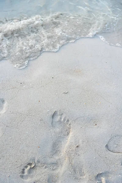 Foot print on sand at beach.Thailand.
