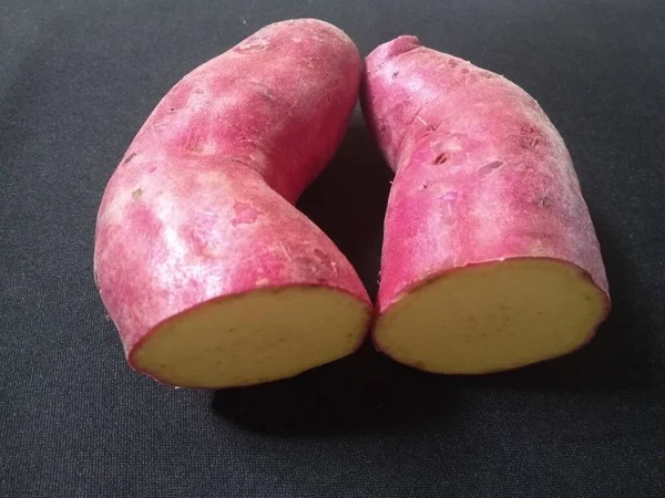 Sweet Pink Potatoes Black Background Close Photo — Stock Photo, Image