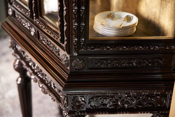 Dear wooden sideboard (cupboard ) with carved patterns, made of red lacquered wood.