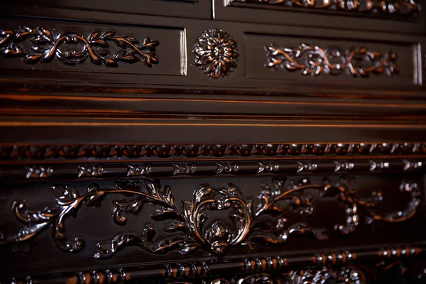 Dear wooden sideboard (cupboard ) with carved patterns, made of red lacquered wood.