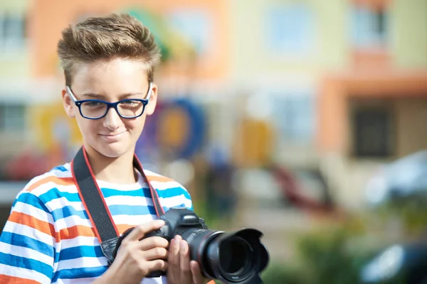 Funny teen boy with digital photo camera — Stock Photo, Image