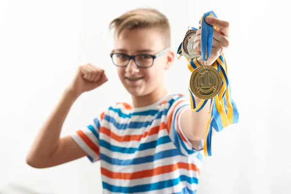 Boy Rejoices Emotionally Celebrates Victory Holds Different Medals His Hands — Stock Photo, Image