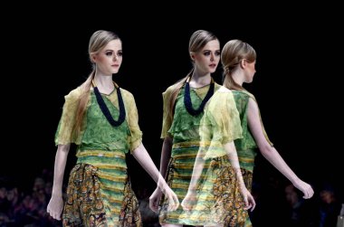 A model demonstrates a dress designed by Pricilia Saputro at the Indonesia Fashion Week