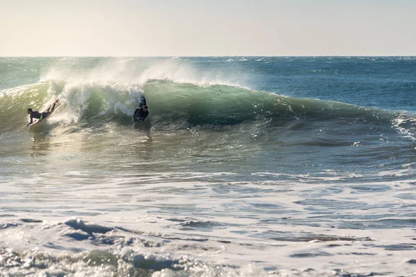 Two Surfers Riding Same Beautiful Wave Sunlight Reflects Gold Foam — Stock Photo, Image