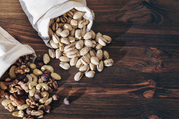 mix nuts dry fruits and pistachios in hessian bags