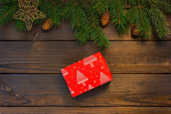 Gift wrapping. Wrapping paper, tape and gift box on a light wooden