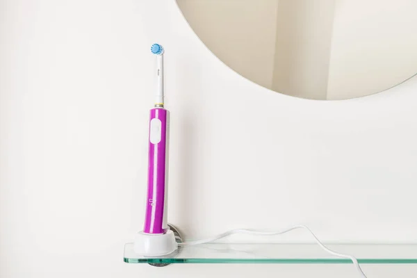 Electric Rechargeable Toothbrushes Bathroom Shelf Light Background — Stock Photo, Image