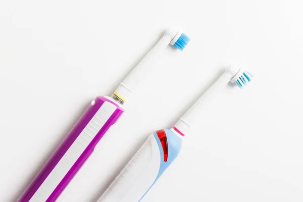 Electric Rechargeable Toothbrushes Family Light Background — Stock Photo, Image