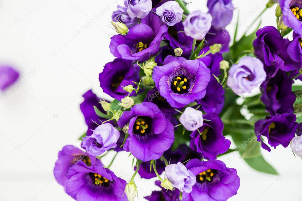 Beautiful Bouquet of Purple Eustoma flowers, Lisianthus, light background