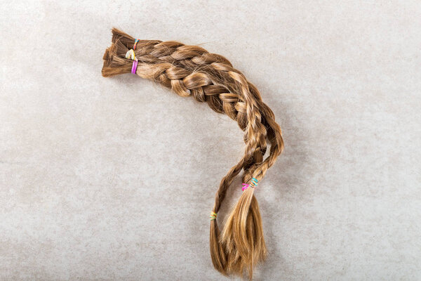 Cut long hair as donation for cancer charity