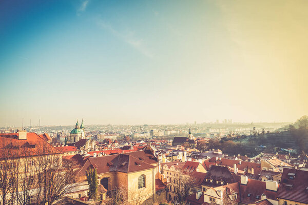 View on Prague panorama with red roofs and historic architecture from staromestska radnice, Old Town Hall, Czech Republic