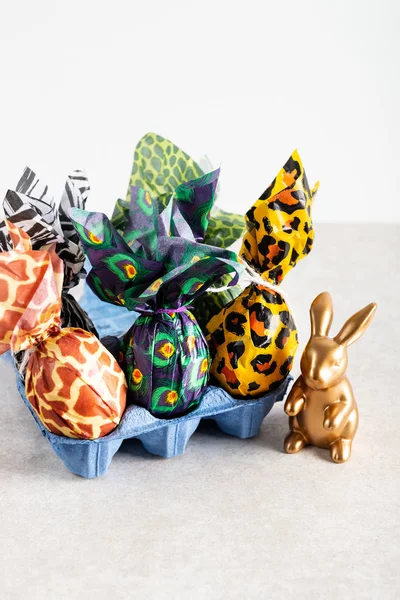 Easter eggs wrapped up in animal print paper — Stock Photo, Image