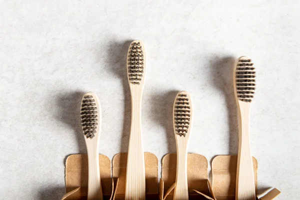 A family set of four wooden bamboo toothbrushes — Stock Photo, Image