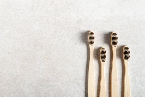 A family set of four wooden bamboo toothbrushes — Stock Photo, Image