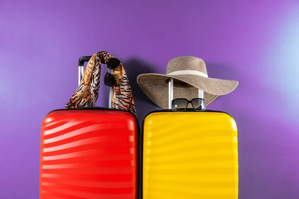 Bright and stylish cabin size suitcases and accessories as holiday concept — Stock Photo, Image