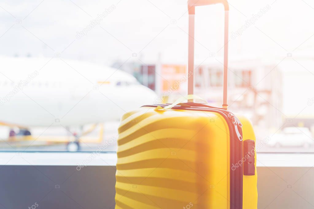 The bright and stylish cabin size suitcase in the airport
