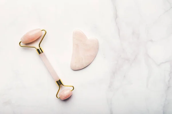 Jade face roller and Gua sha stone — Stock Photo, Image