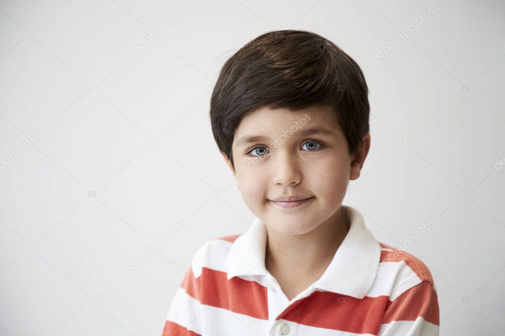 Boy in polo shirt smiling to camera
