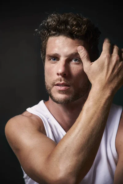 Blue eyed man in vest, portrait