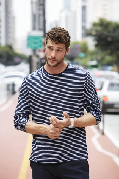 Young dude in striped top, looking away