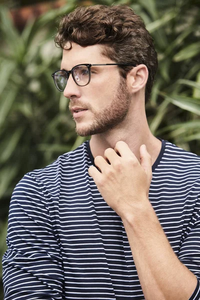 Good looking guy in glasses, looking away