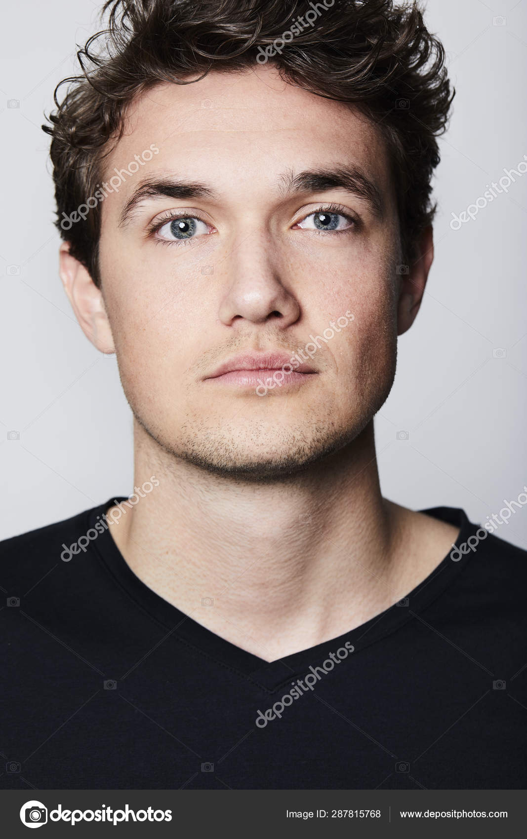 Portrait Of A Nice Young Attractive Man With Blue Eyes Stock Photo