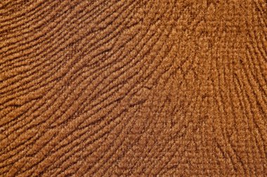 Yumuşak kumaş doku kahverengi renktedir. Yüksek çözünürlüklü fotoğraf.