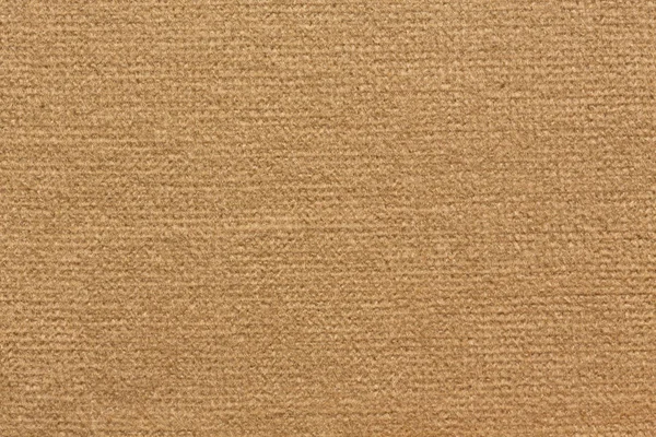 Textile background in simple light brown tone. High resolution photo.