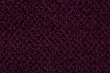 Kabartmalar ile derin mor kumaş arka plan. Yüksek kaliteli kumaş dokusu.