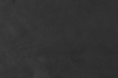 Üzerinde tahıl ve bir ışık mili gösteren siyah deri bir swatch bir bölümünün yakın