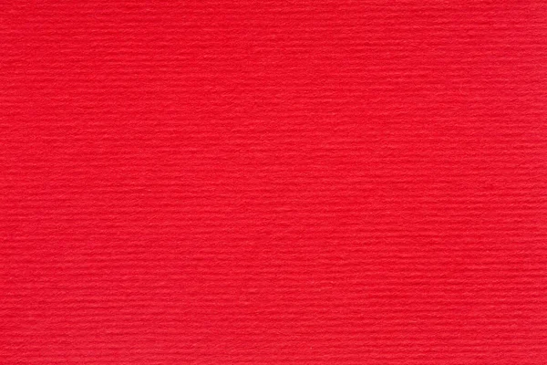 Abstrakter roter Hintergrund oder weihnachtliche Textur. knallrot liniertes Papier in Nahaufnahme. — Stockfoto