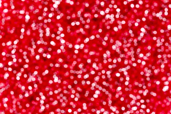 Kırmızı odaklı ışıklar arka planda. Kırmızı bokeh dokusu. Xmas ışıkları.