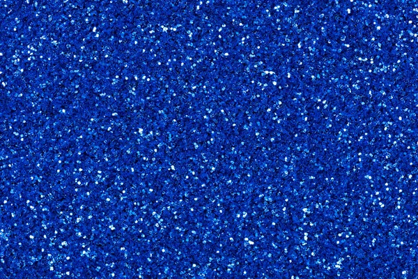 New glitter background, texture in blue tone with contrast sparkles.