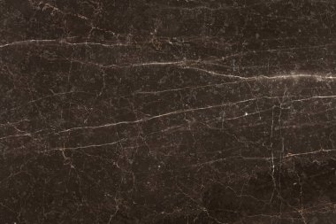 Küçük beyaz çizgileri olan kahverengi mermer arkaplan.