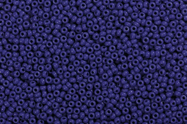Ciemnoniebieskie koraliki w formie tekstury zbliżenie. — Zdjęcie stockowe