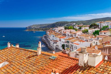 Top view in Cadaques, Catalonia, Spain near of Barcelona. Scenic old town with nice beach and clear blue water in bay. Famous tourist destination in Costa Brava with Salvador Dali landmark clipart